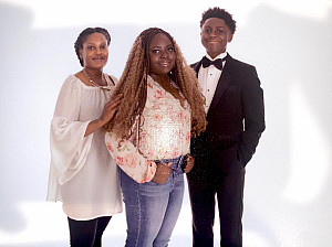 Niala Cole (center) with her mother, Rosaline, and brother, Adonis DLS '24